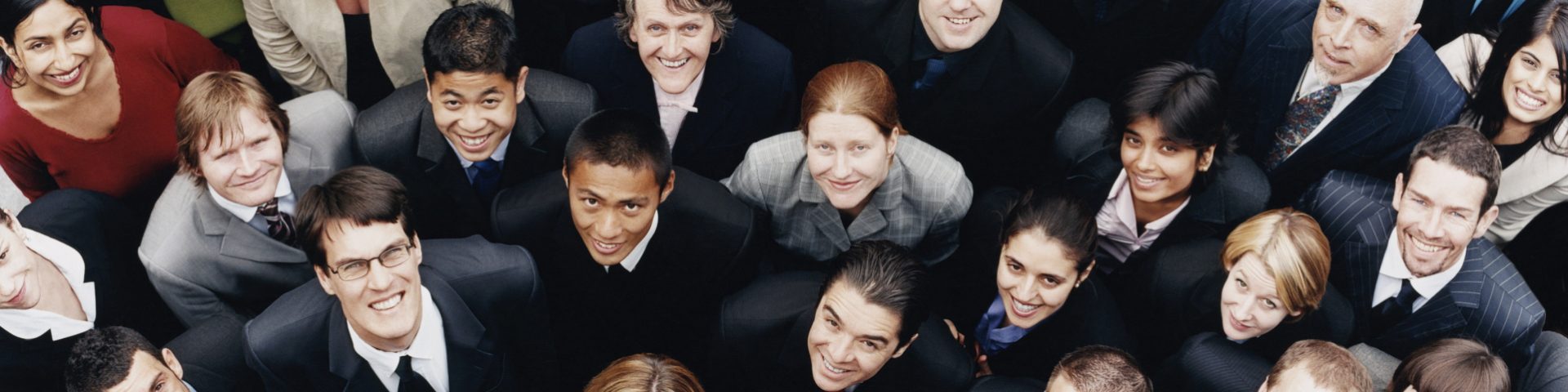 Large Group of Business People Standing and Looking up at Camera